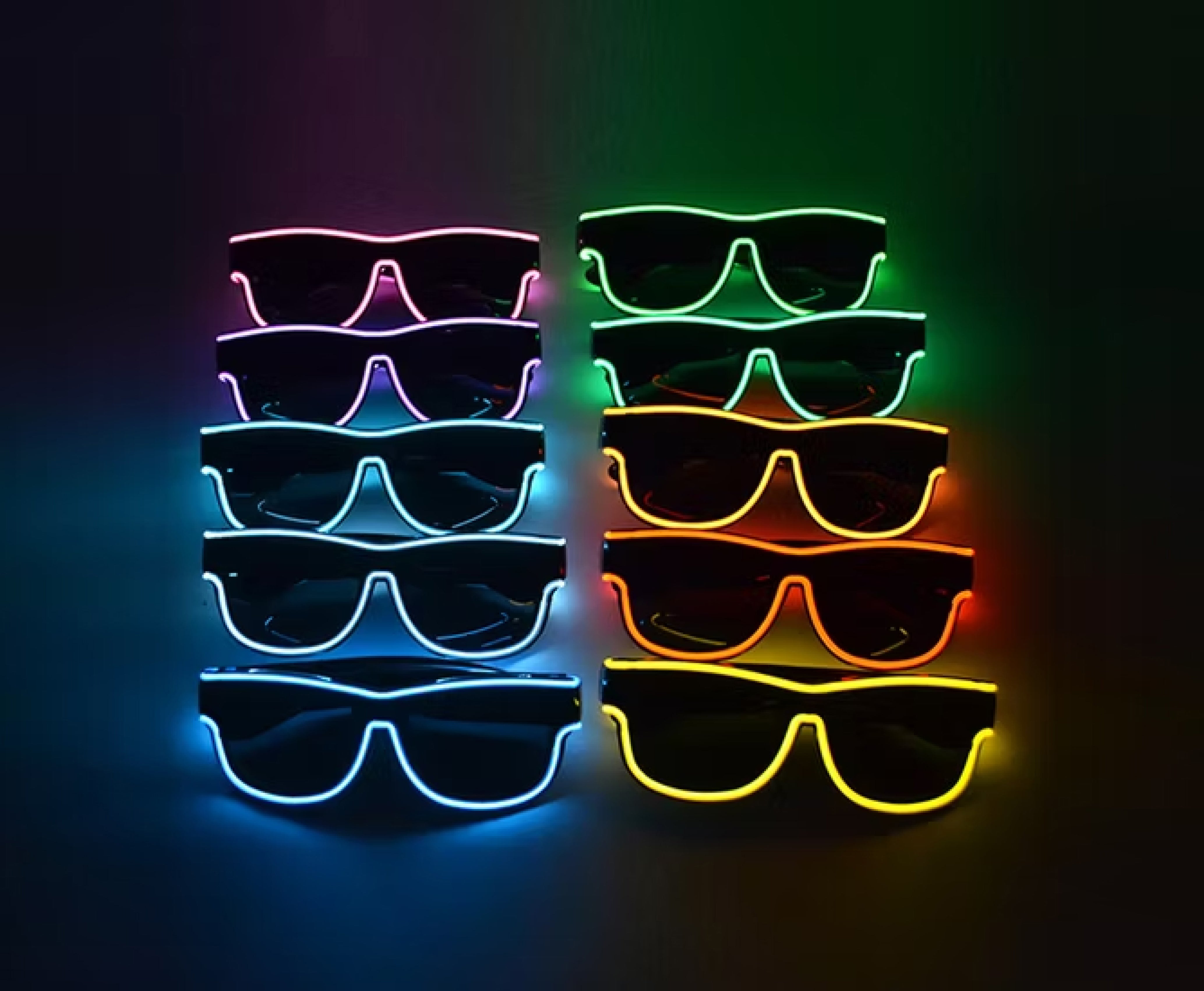 Stacks of colorful LED sunglasses on a dark background